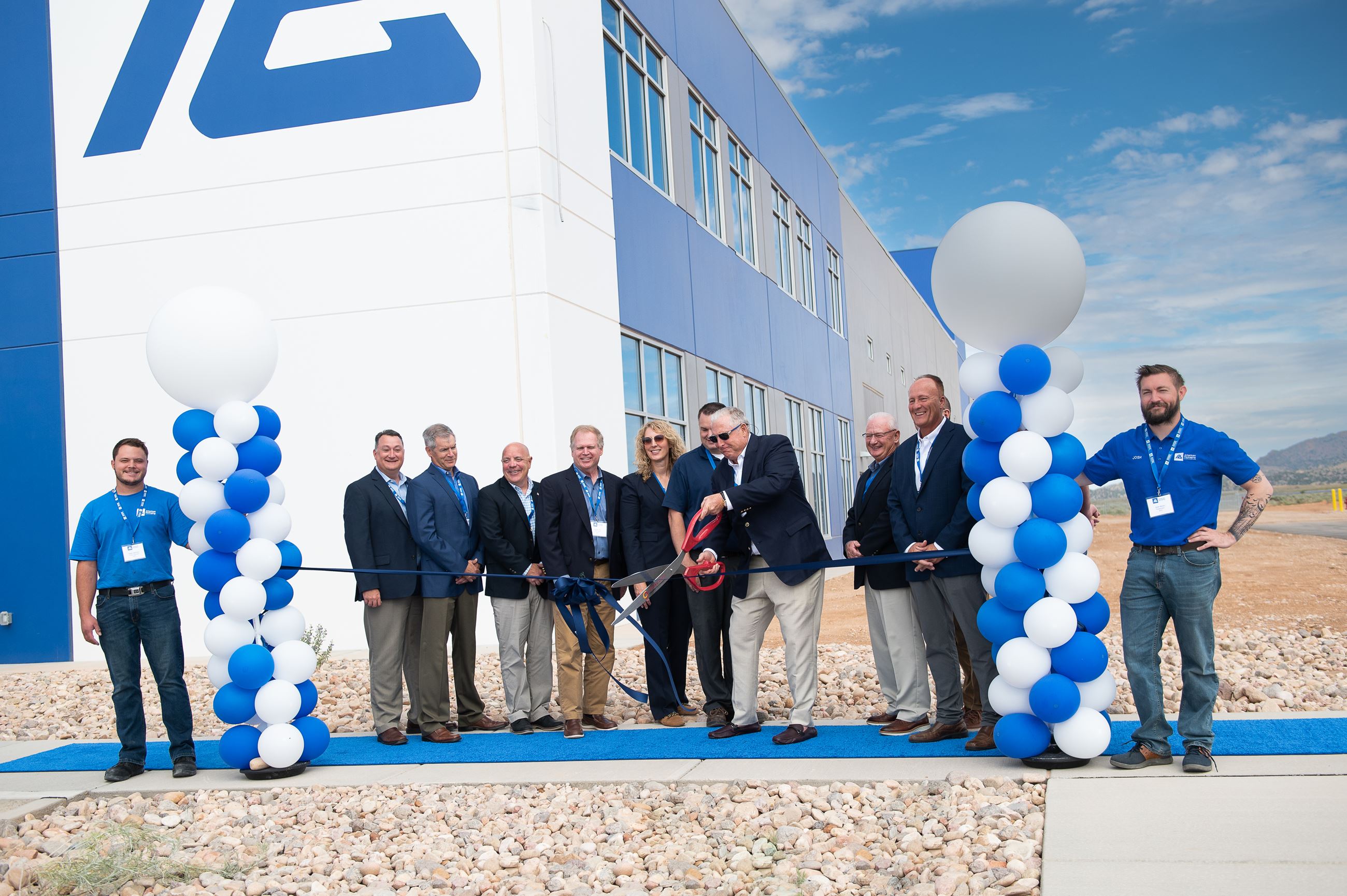American Packaging Corporation group photo with ribbon cutting
